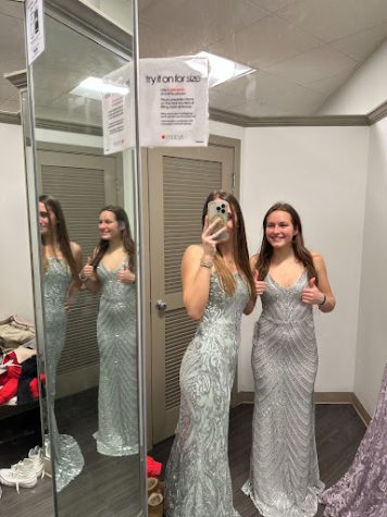 To combat the difficulties of dress shopping, students went shopping together to make the experience more enjoyable. Pictured above is seniors Lexi Stein and Anastasiia Goi shopping for their ‘perfect’ prom dresses. 