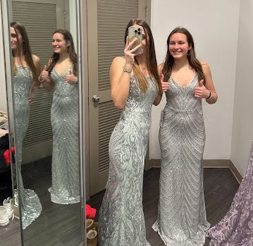 To combat the difficulties of dress shopping, students went shopping together to make the experience more enjoyable. Pictured above is seniors Lexi Stein and Anastasiia Goi shopping for their ‘perfect’ prom dresses. 