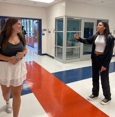 Senior Callie Maddox receiving the compliment “You look pretty today” from junior Iveth Flores. With her bright facial expressions and positive body language, she seemed to appreciate the compliment.