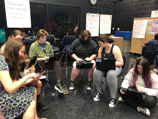 (From left to right: senior Miranda Dress, junior Alina Yang, senior Meredith Turcotte, senior Christopher Seeger, sophomore Asher Stites, sophomore Madeleine Klahr, sophomore Kay Rogers) Seven tech theatre students laugh and chat. When asked if women being included was a focus of the class, Klahr replied, “It’s not focused on as much race, gender, sexuality, it’s just what you contribute and how much you respect everyone.”