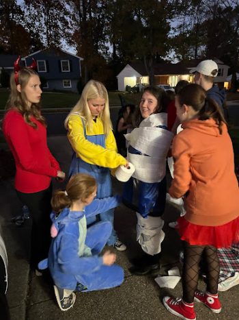 As part of Halloween festivities, students played ‘wrap the mummy,” in which participants wrap a volunteer in toilet paper. Uniquely American activities such as making s’mores and cornhole were also enjoyed before the night ended with a round of trick-or-treating. 