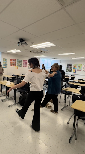 Senior Katie Tragakis is doing the Hasapiko, a traditional Greek Dance. Greek club members are learning the Hasapiko, which they will perform at International Night. 