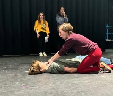 From left to right, freshman Max Gerstenberg and sophomore Jasper Lester rehearse on stage. The two star in “The Undeath”, a comedic one-act about zombies. The act is directed by junior Ash Virts and written by senior Scarlet Schulz.