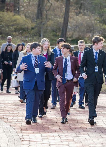 Senior Caleb Quiroga (leftmost) walks with Peyton White from South Carolina. One of the activities representatives to the Senate Youth Program took part in was touring Mount Vernon to learn about the life and career of former President George Washington.