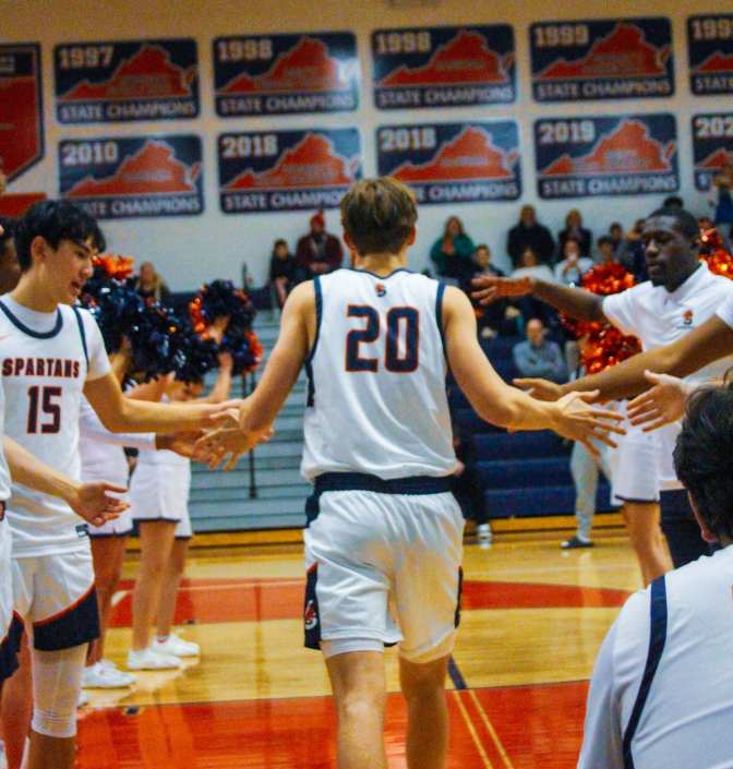Entering the game, teammates cheer on the starters, creating a tunnel and handing out high fives. This is a  tradition for the Spartans extending back years.