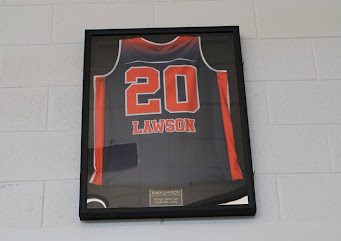 Lawson’s Spartan basketball jersey continues to hang above the main gym entrance to honor her prolific career.